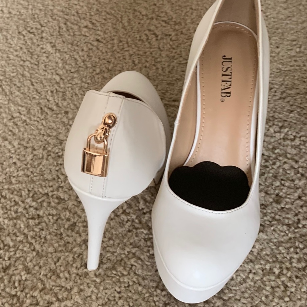 Brand New White lock platform heel no foot pads.